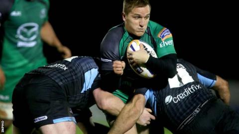 Connacht pair Paul O'Donohoe and Jon Welsh tackle Glasgow's Gordon Reid