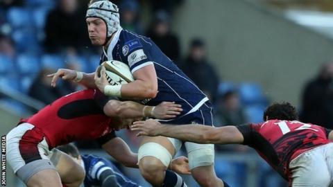 Bristol's Mitch Eadie forces his way through the London Welsh defence