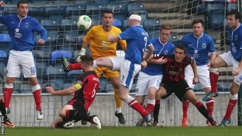 Crusaders captain Colin Coates heads towards the Linfield goal