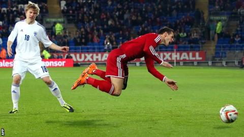 Wales forward Gareth Bale is fouled by Finland's Jere Uronen
