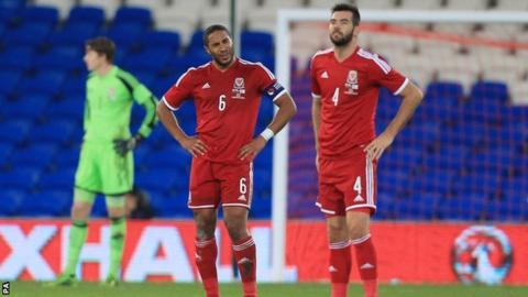 Wales pair Ashley Williams and Joe Ledley show their frustration after conceding a late equaliser to Finland