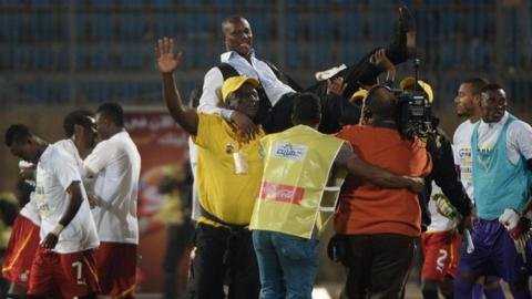 Coach Kwesi Appiah is lifted up high after Ghana qualify for the World Cup in Brazil