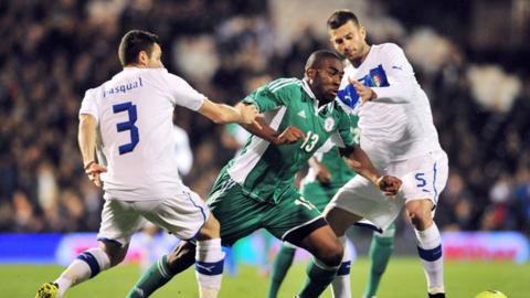Dike (centre) in action against Italy