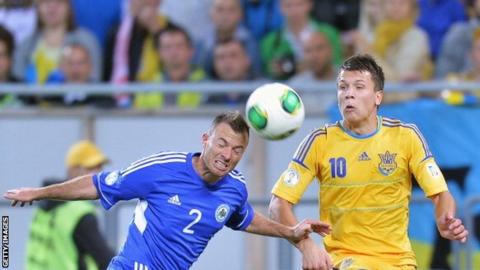 Carlo Valentini (left) of San Marino with Ukraine's Yevhen Seleznyov