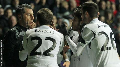 Swansea players remonstrate with the linesman after Vasquez's goal is ruled out for offside
