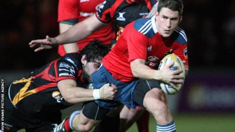 Munster's Ian Keatley is tackled during the win over the Dragons