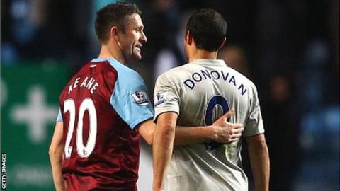 Robbie Keane (left) and Landon Donovan in Premier League action