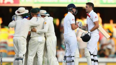Joe Root and James Anderson shake hands after loosing the first test at the Gabba