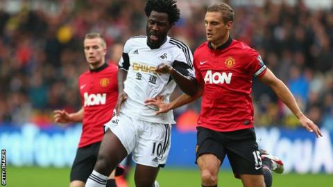 Swansea City's Wilfried Bony and Manchester United's Nemanja Vidic in action in the Premier League