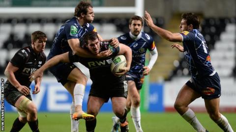Ospreys' Ryan Bevington is tackled by Remi Lamerat