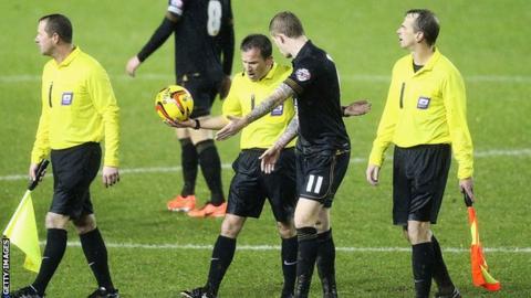 James McClean speaks with referee Keith Stroud