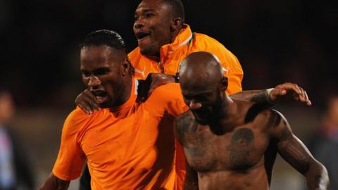 Ivory Coast players celebrate their World Cup play-off win over Senegal