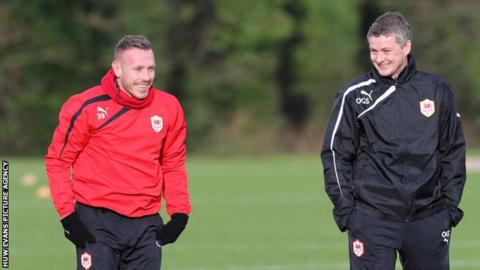Cardiff City's Craig Bellamy and new manager Ole Gunnar Solskjaer