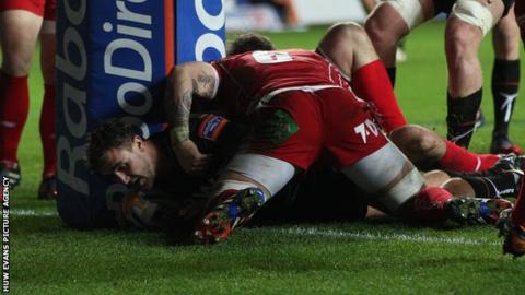 Ashley Beck scores the ospreys first try against the Scarlets