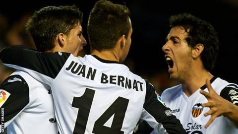 Valencia players celebrate scoring against Levante