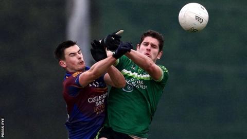 Limerick's Eoin Carroll battles with QUB's Harry Og Conlon at the Dub