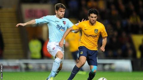 Oxford's Danny Rose and Exeter's Arron Davies