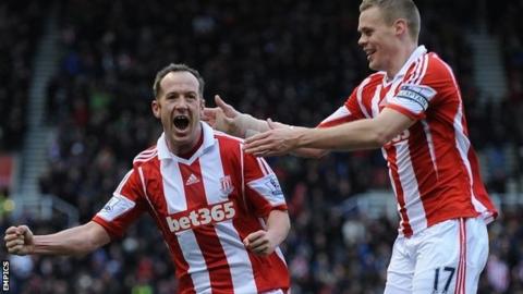 Charlie Adam celebrates after scoring Stoke's opening goal