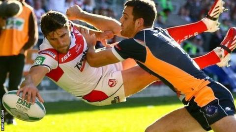 Tommy Makinson goes airborne to score a try for St Helens against Hull KR in last-season's play-offs