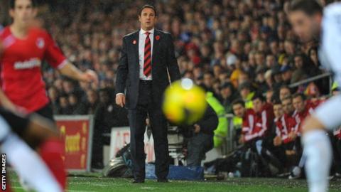 Malky Mackay watching Cardiff City against Swansea City