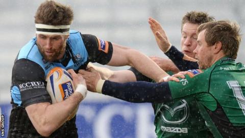 Glasgow Warriors' Richie Vernon (left) is tackled by Matt Healy