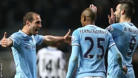 Pablo Zabaleta celebrates with Fernandinho and Alvaro Negredo