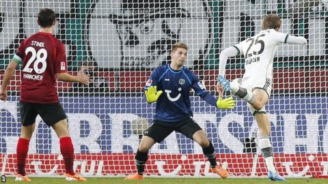 Thomas Muller heads in a goal as he sets Bayern Munich on their way to victory over Hannover 96