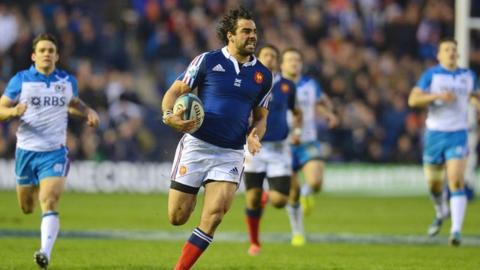 France's Yoann Huget scores against Scotland