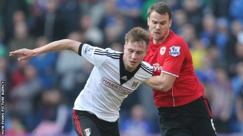 Ben Turner (right) in action against Fulham's Cauley Woodrow