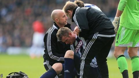Chris Brunt was injured in his side's 3-0 defeat by Manchester United