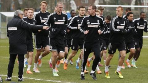 Fulham manager Felix Magath (left) takes a training session