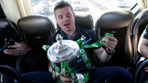 Brian O'Driscoll with the Six Nations trophy on Sunday morning in Paris