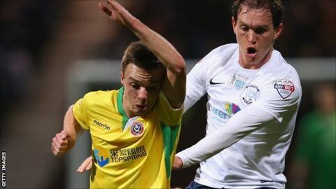 Stefan Scougall of Sheffield United and Preston's Neil Kilkenny