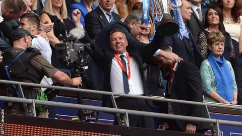 Peterborough United manager Darren Ferguson holds the Johnstone's Paint Trophy