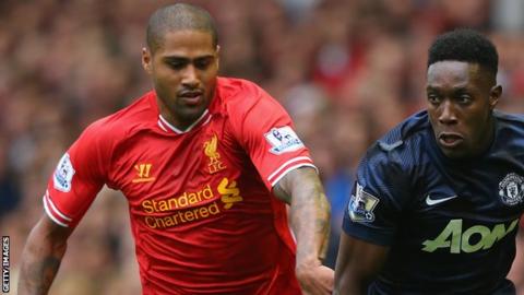 Liverpool's Glen Johnson battles with Danny Welbeck of Manchester United