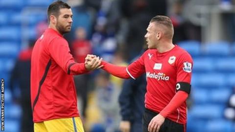 Crystal Palace's Joe Ledley shakes hands with Cardiff City's Craig Bellamy