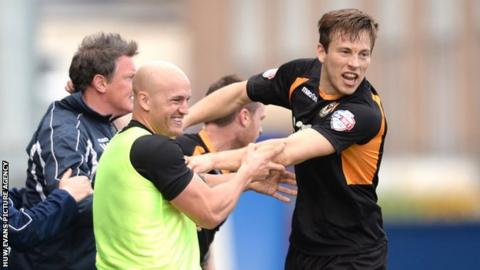 Max Porter celebrates his goal against Chesterfield with his team's substitutes