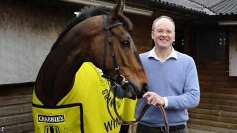 Grand National winner Pineau De Re and winning trainer Dr Richard Newland, from Claines, Worcestershire