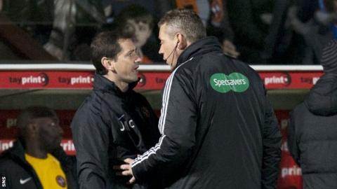 Dundee United boss Jackie McNamara is spoken to by the fourth official