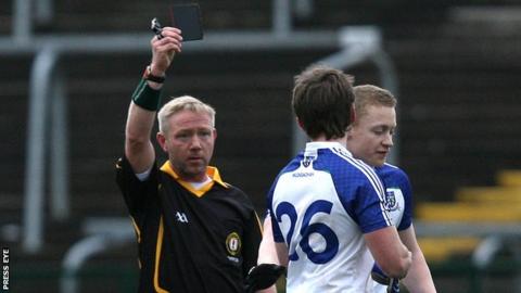 Referee Brendan Rice hands out a black card to Monaghan's Dessie Mone in the McKenna Cup