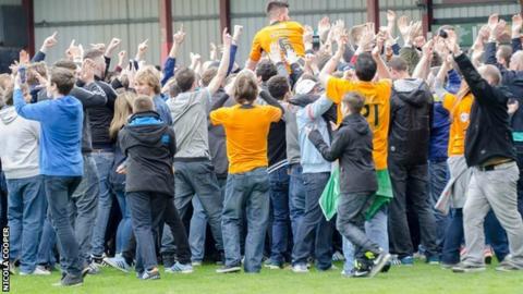 Wolves defender Danny Batth is chaired off by the travelling Wolves fans at Gresty Road