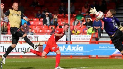 Crawley Town's Andy Drury heads his side's winner past Leyton Orient goalkeeper Jamie Jones