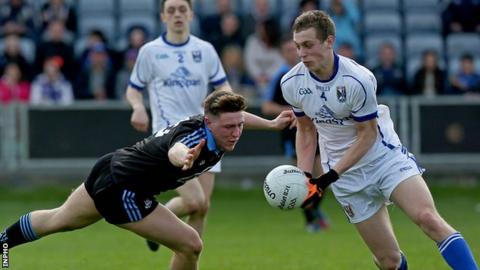 Dublin's John Small challenges Cavan defender Padraig Faulkner