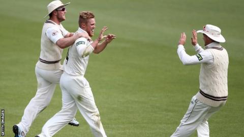Matthew Dunn celebrates the dismissal of Essex opener Alastair Cook