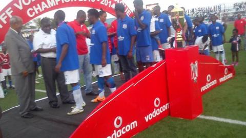 Azam players receive their league winners' medals