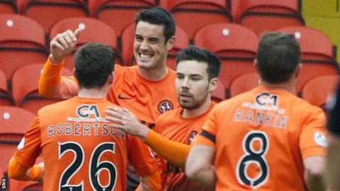The Dundee United players congratulate Brian Graham on his goal