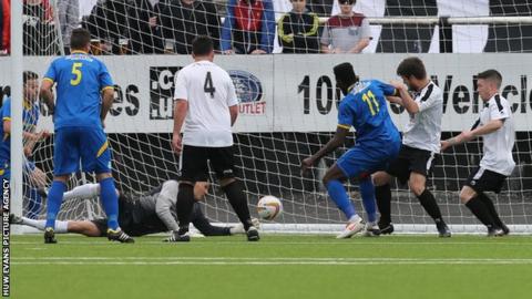 Paulton's Nick McCootie scores