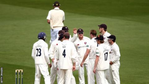 Kent players celebrate the departure of Surrey batsman Graeme Smith