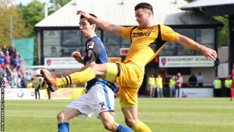 Newport's Andrew Hughes challenges Rochdale's Peter Vincenti