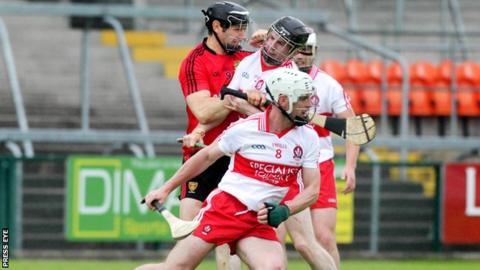 Oisin McCloskey (centre) scored Derry's goal against Down